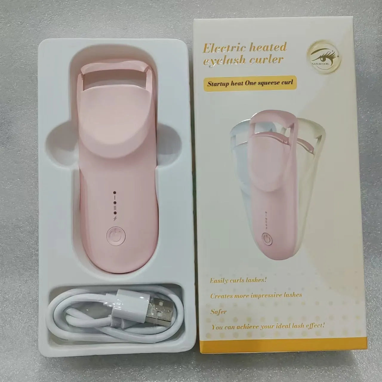 USB rechargeable electric eyelash curler in cream white, maca pink, or vanilla apricot colour with ceramic heating plate.