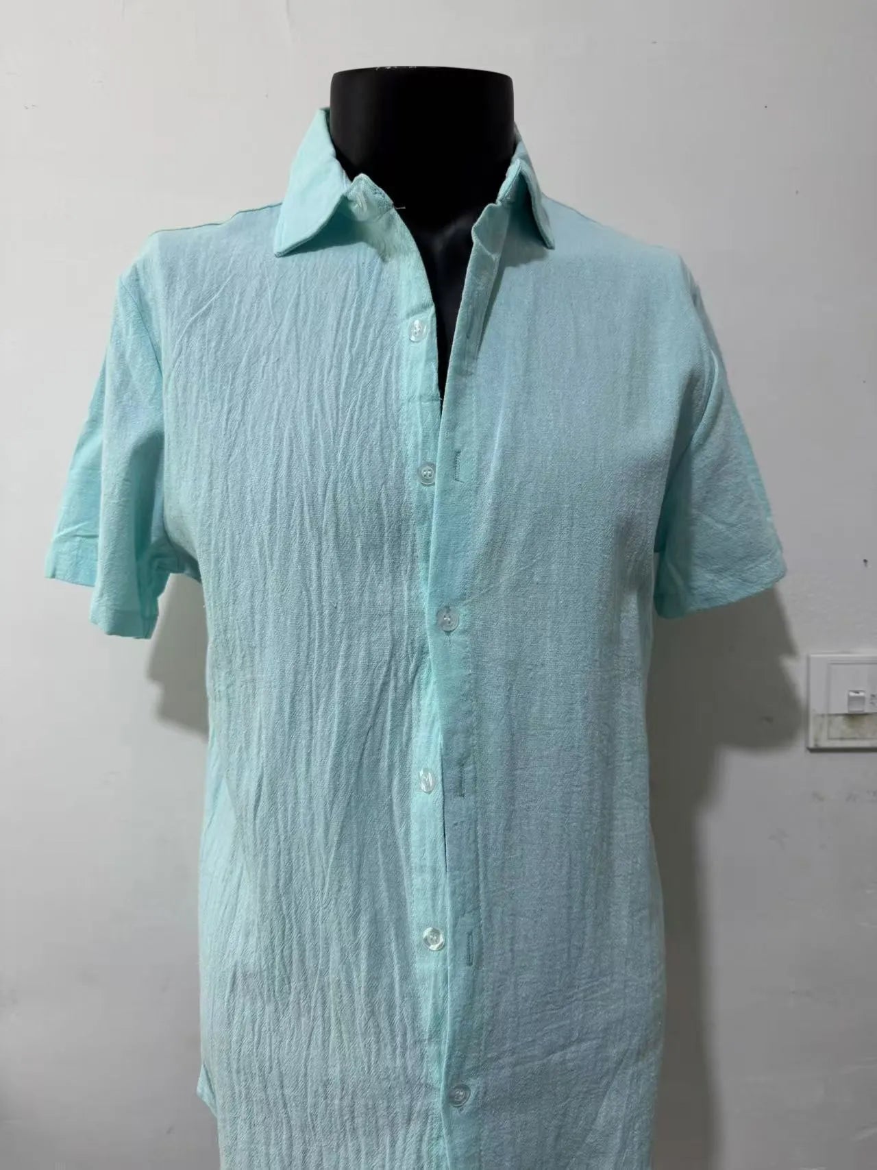 Men's light blue linen blend short sleeve shirt with loose fit on hanger
