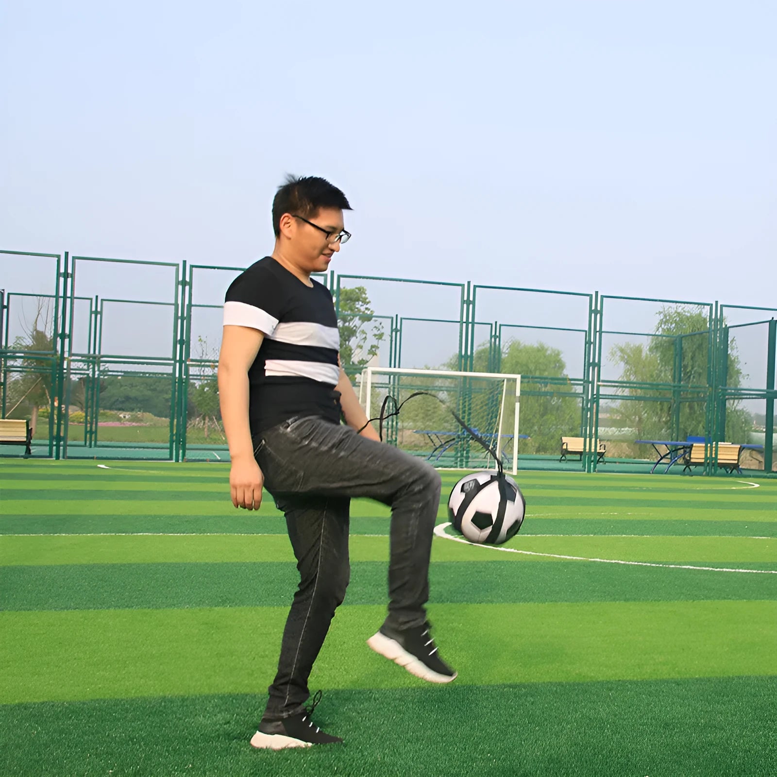 Black football juggling belt with rotating mechanism for ball control training