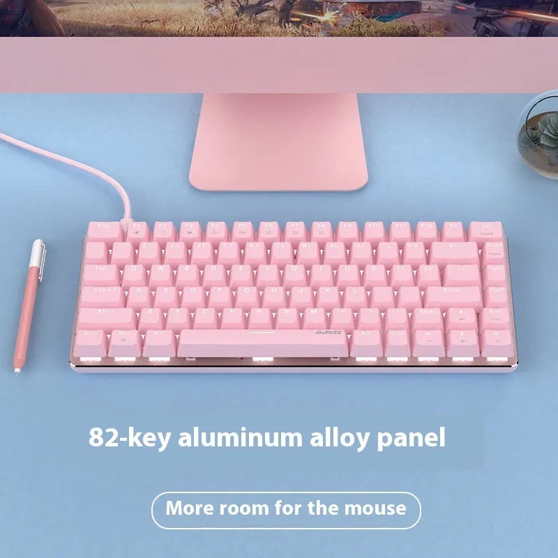 82-key mechanical keyboard with white backlight and metal construction beside laptop