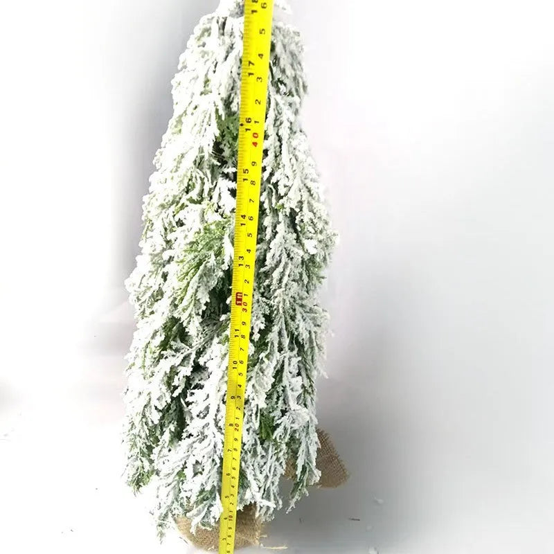 24-inch artificial Christmas tree with white snow finish and built-in LED lights on branches