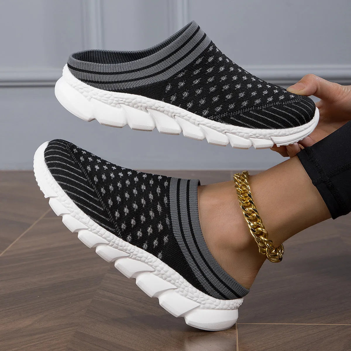 Women's striped Flyknit slipper shoes in black, pink, or purple with hollowed-out sewing line details