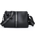 Black genuine leather crossbody bag with adjustable strap and large 24x16x13cm capacity.
