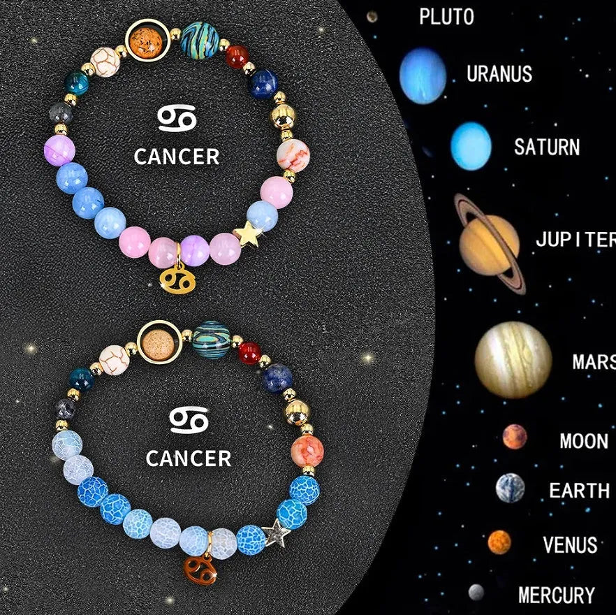 Two adjustable natural stone beaded bracelets with metal zodiac sign charms on a wooden surface.