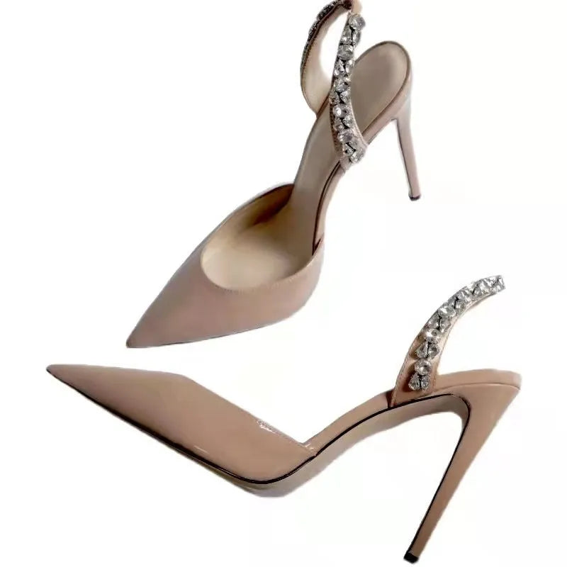 Pointed toe high heel sandals with rhinestone decoration on the side, in patent leather.