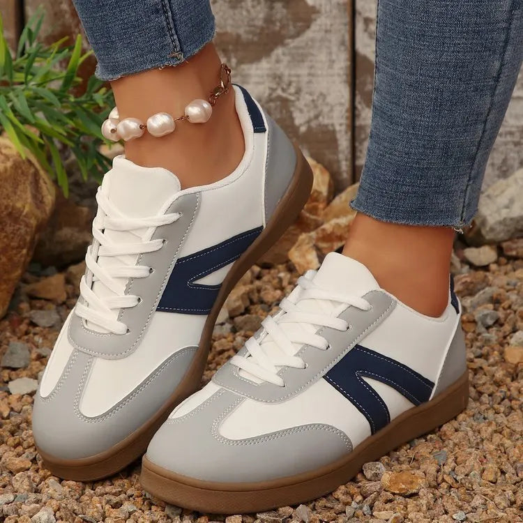 Blue women's low-top lace-up hiking shoes with an artificial PU upper and rubber sole.