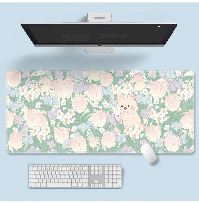 Large floral cartoon pattern mouse pad on a desk, showing non-slip rubber base and colourful design.