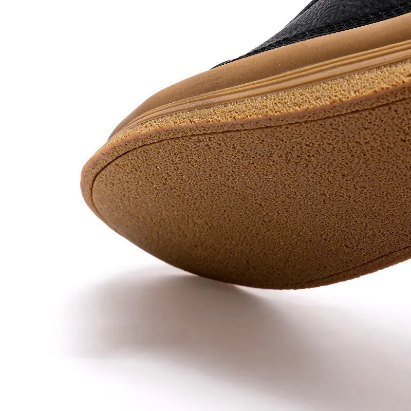 Men's black leather casual lace-up shoes with a round toe and flat rubber sole on a white background.