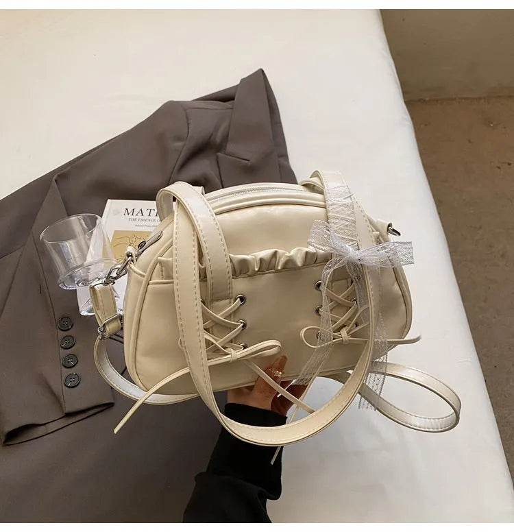 Women's casual PU shoulder handbag with a bandage bow and phone compartment in multiple colour options.