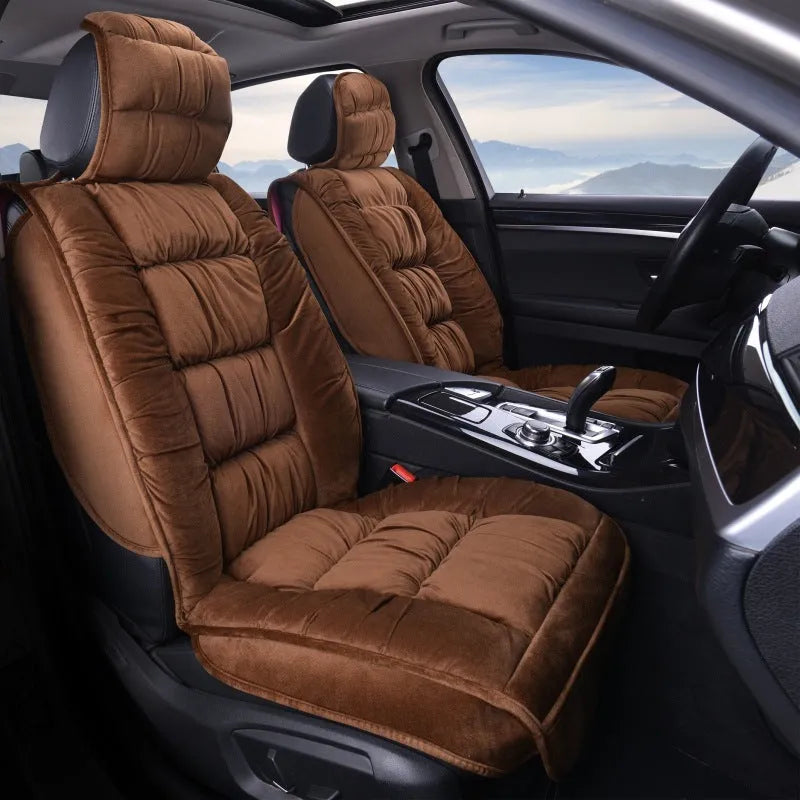 Short plush car seat cushion in charcoal grey on vehicle seat