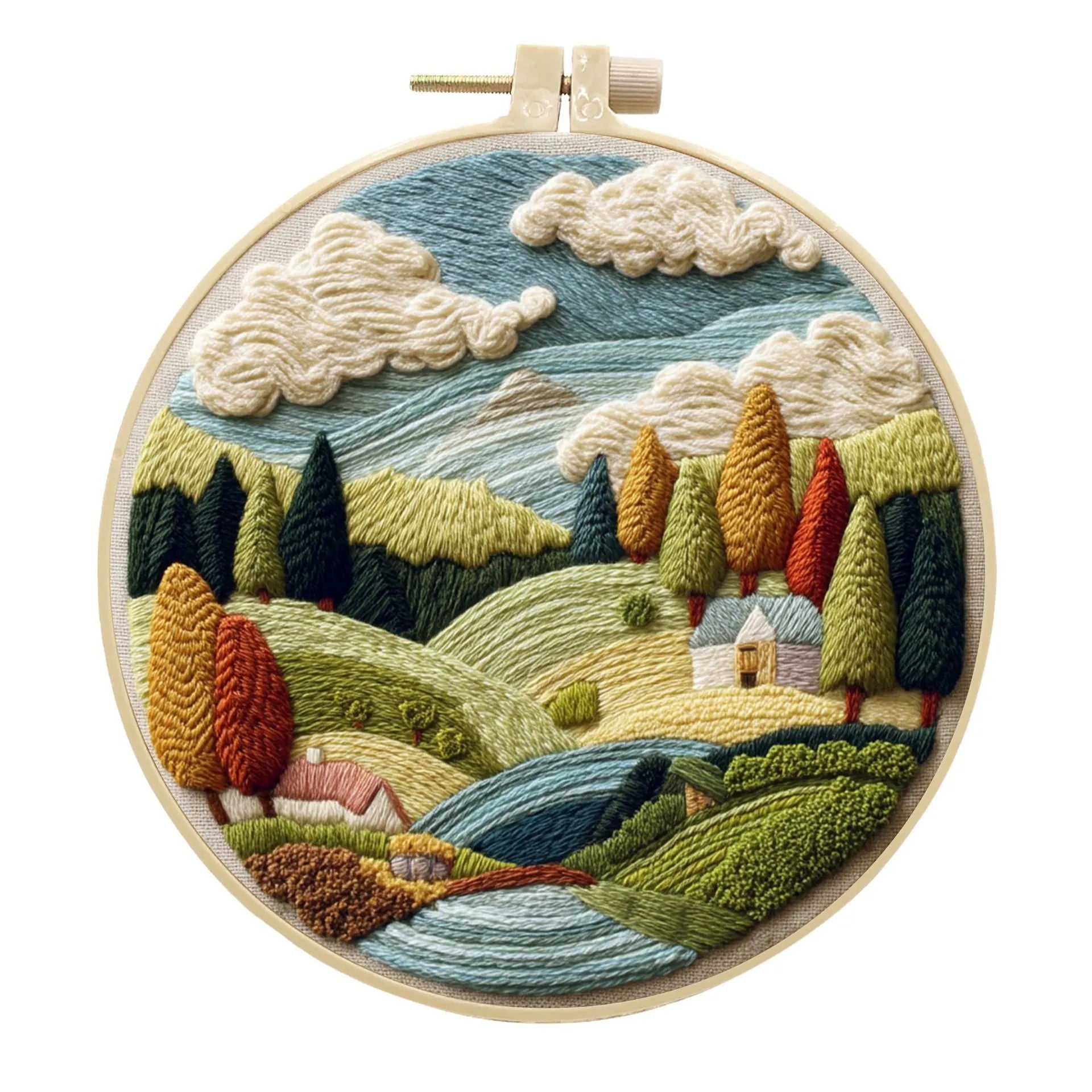 DIY embroidery kit with landscape-printed cotton fabric, embroidery hoop, needles, and coloured thread spools.