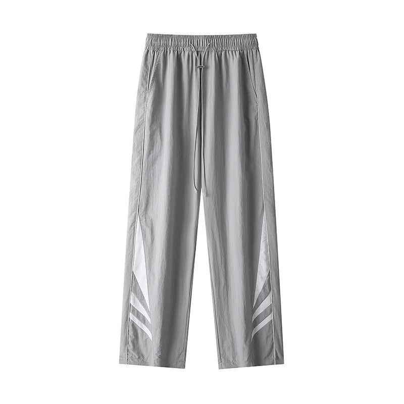 Black straight-leg loose-fit trousers on a plus-size male model for summer casual wear.