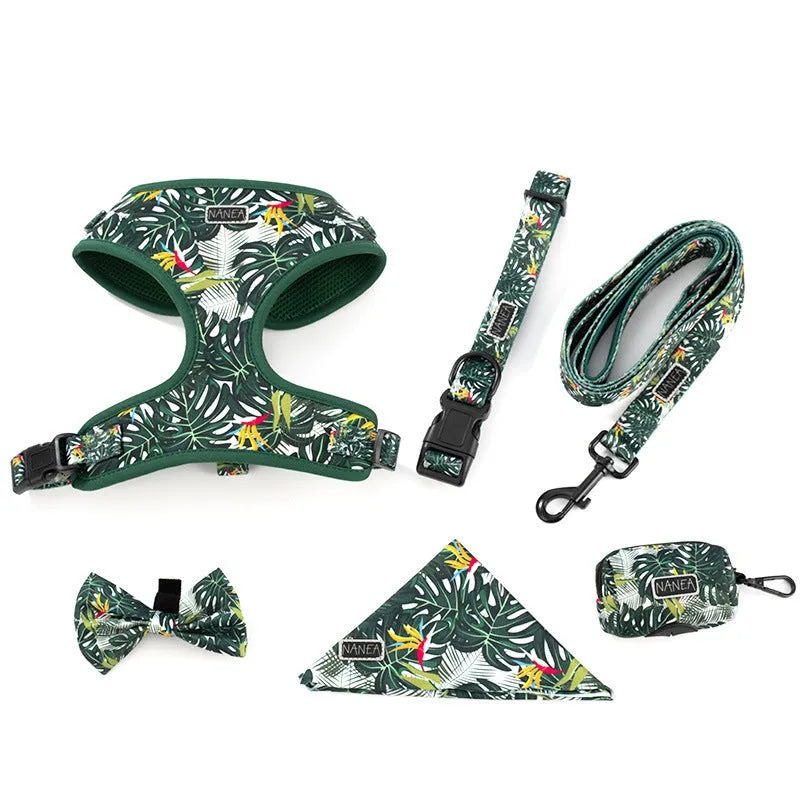 Six-piece adjustable cloth dog harness set with leash, collar, waste bag, bow, and bib scarf in assorted colours.