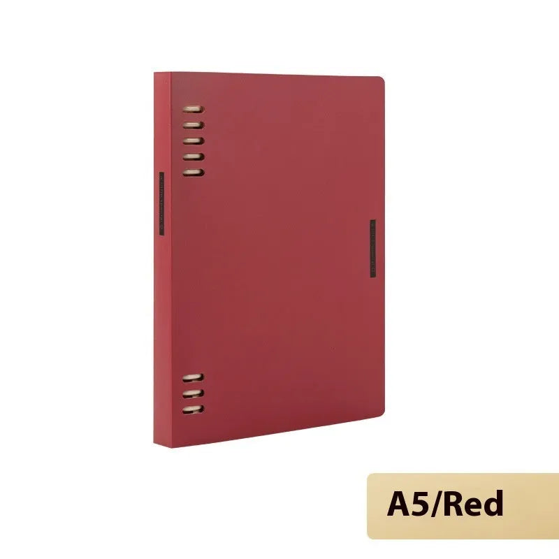 Refillable loose-leaf spiral notebook with PP cover open, showing raw wood pulp paper in grid ruling.