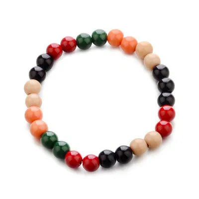 Natural stone beaded bracelet with lava stone beads on wrist, showing ethnic design and essential oil application