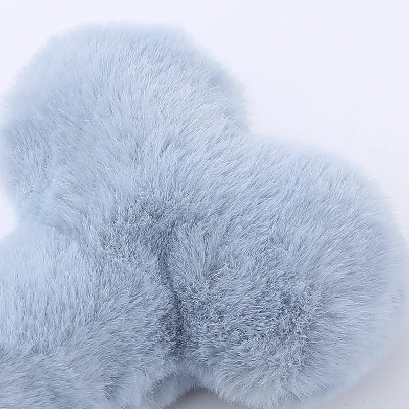 Blue plush bone-shaped dog toy with a vocal squeaker for interactive chew play