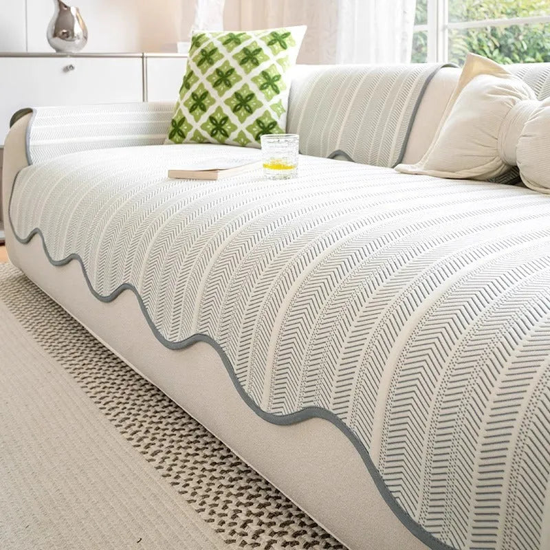 Ice Silk special-pattern sofa cover in Jelly Green laid over a grey sofa, showing non-slip edges.