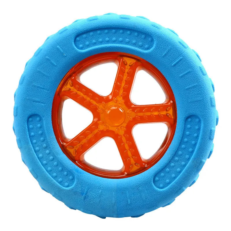 Set of four floating TPR dog toys: a squeaky ball, barbell, and two tires for water fetch.