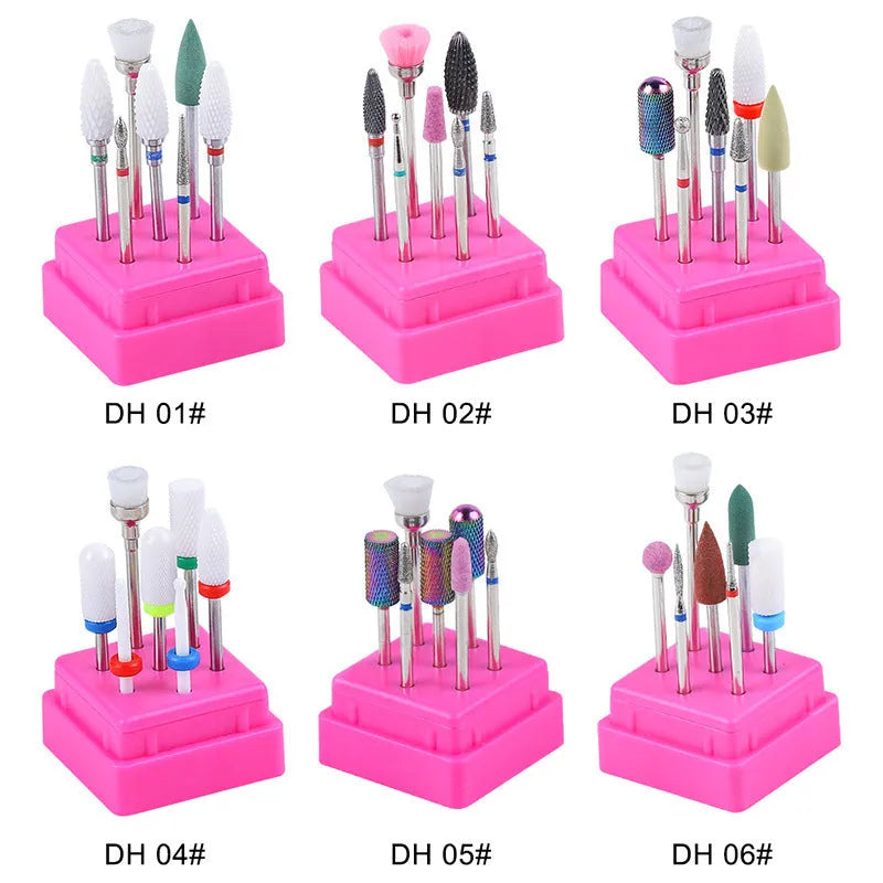 Set of seven tungsten steel nail drill bits and a brush in a clear plastic case.