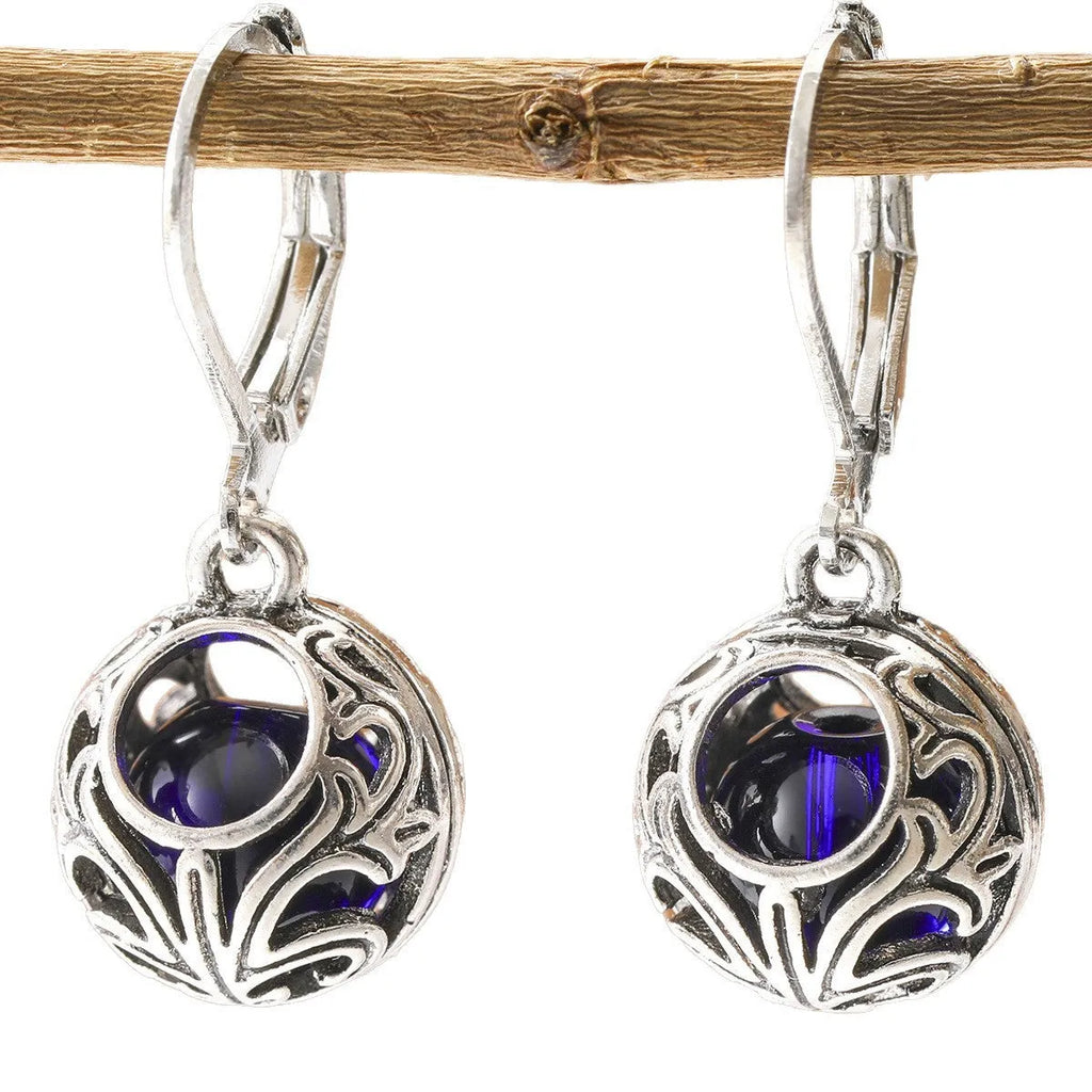 Vintage geometric blue gemstone pendant earrings with hollow engraving detail in silver-tone zinc alloy