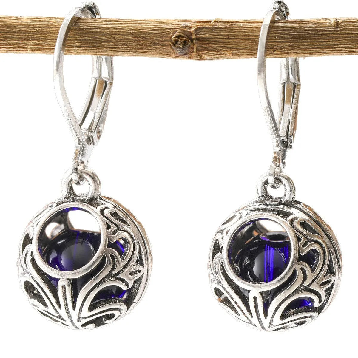 Vintage geometric blue gemstone pendant earrings with hollow engraving detail in silver-tone zinc alloy