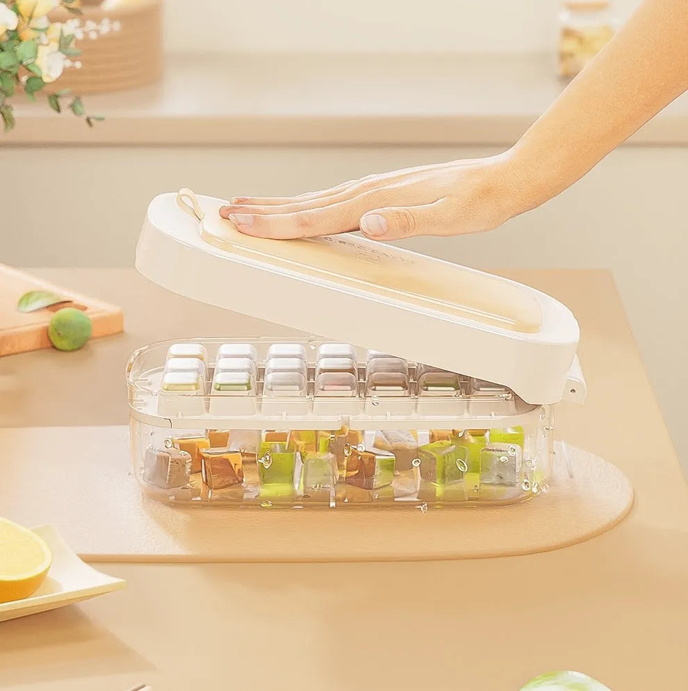 Blue food-grade plastic ice cube tray with grid design and integrated ice shovel storage.