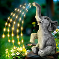 Resin elephant garden sculpture with LED lights for outdoor decoration.