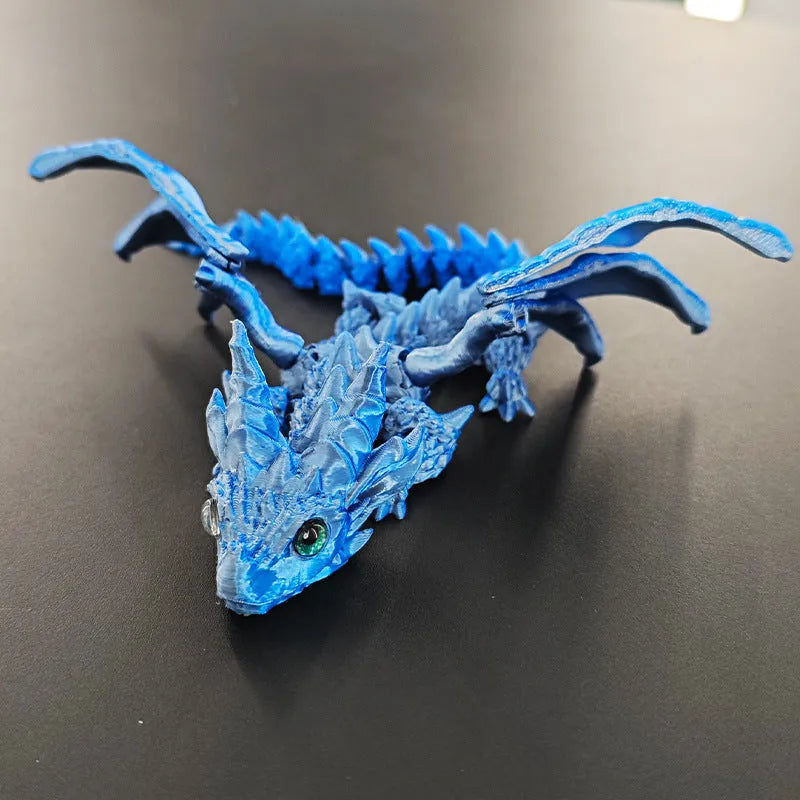 Red and gold 3D printed dragon wings toy decoration on a white background.