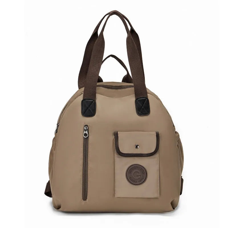 Large lightweight outdoor backpack in black, khaki, or green with rabbit print, showing front sandwich pocket.