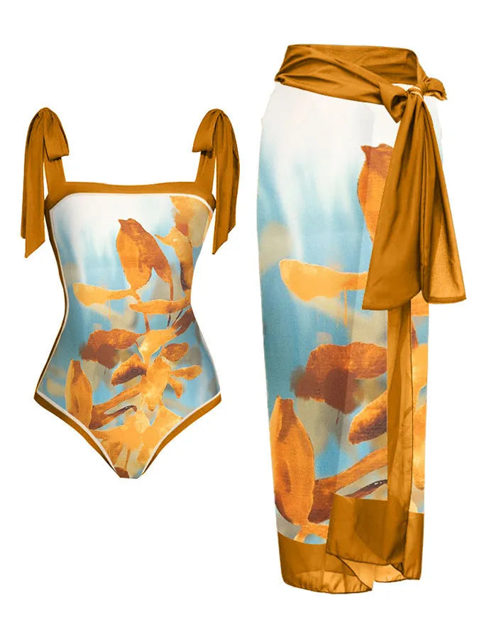 Women's printed chiffon two-piece swimsuit set with a separate hip skirt.