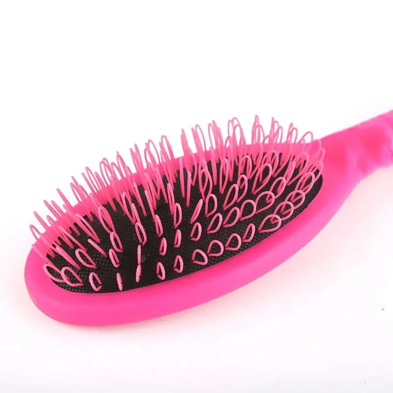 Black or pink plastic ring tooth hair extension comb with airbag cushion measuring 22x6cm