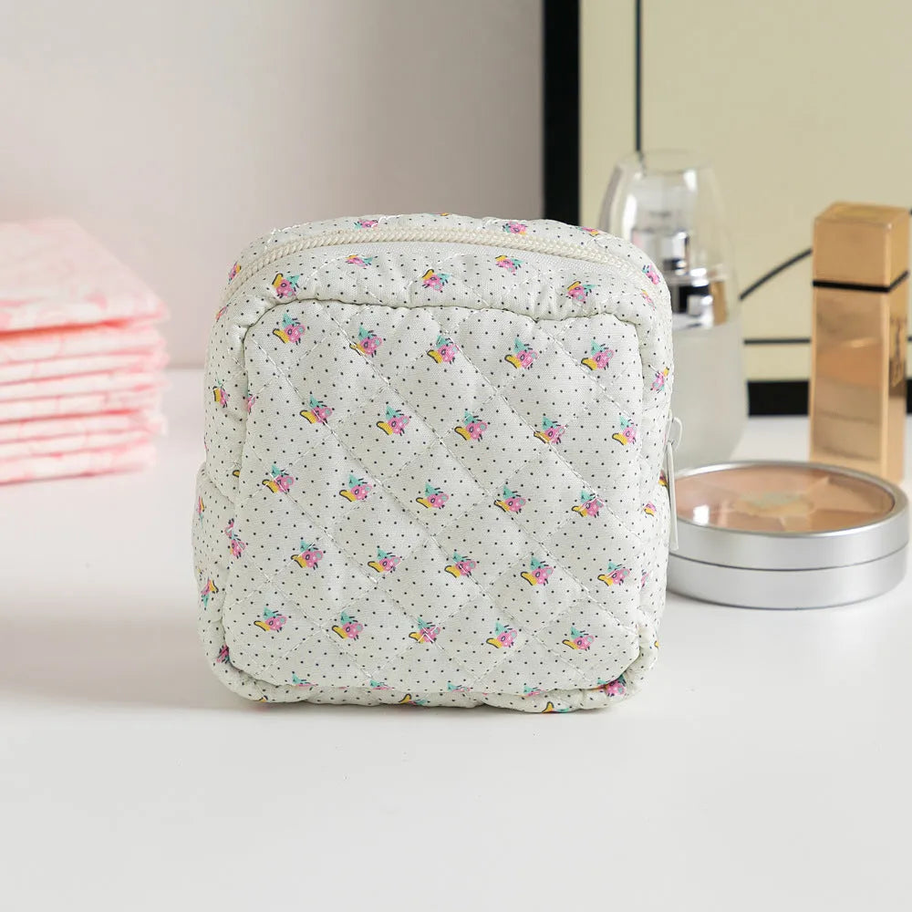 Breathable polyester key storage bag showing multiple floral and cherry pattern options including white background designs