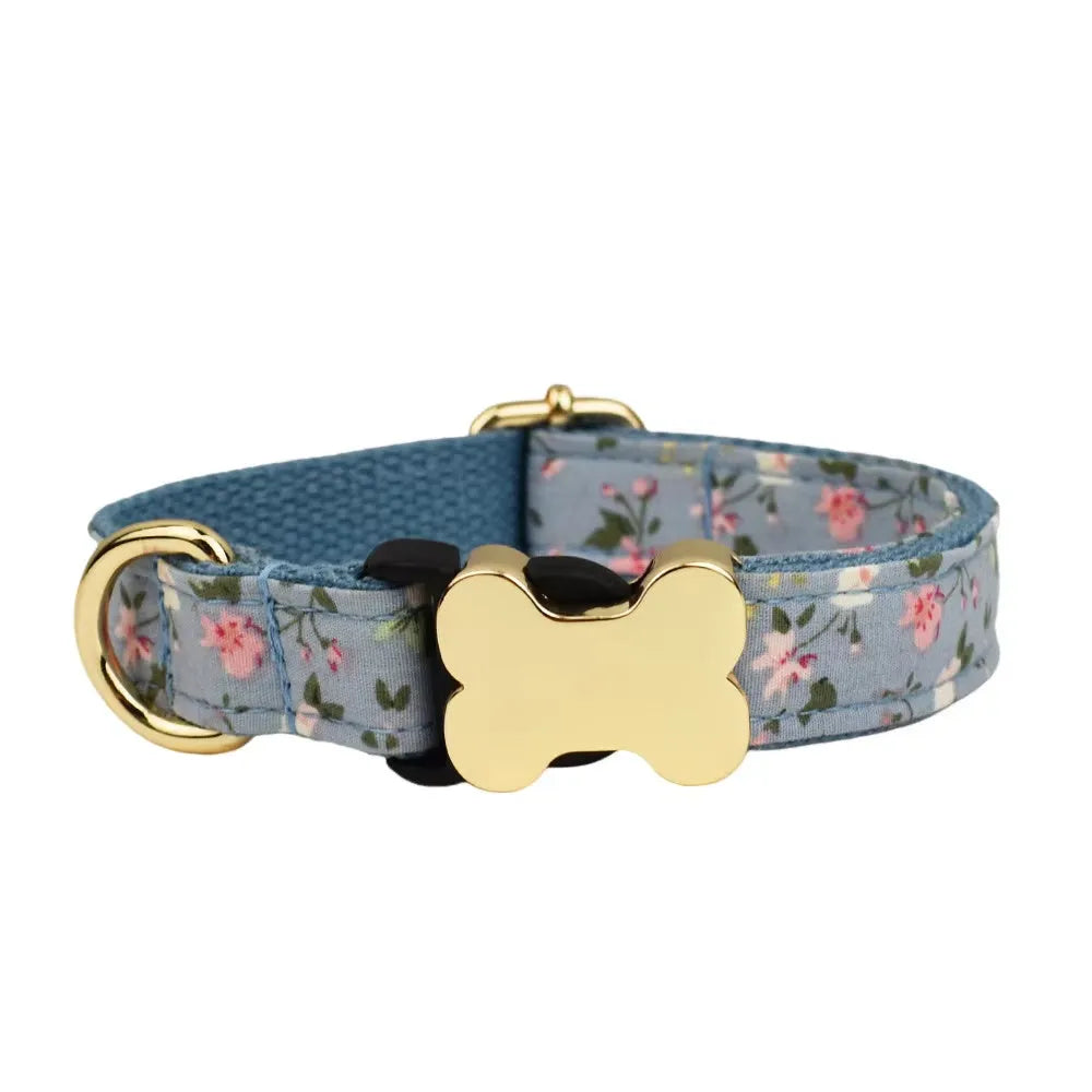 Flat nylon dog collar with grey grid print and a white bone-shaped plastic buckle.