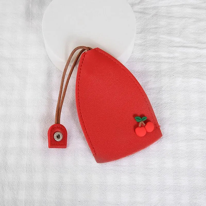 Cartoon design pull-out car key case made from soft PU leather, showing approximate size.
