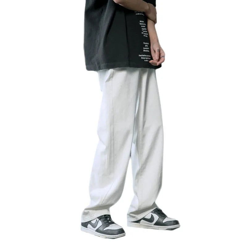 Loose straight cotton denim jeans for men in light blue colour with mid waist and button fly