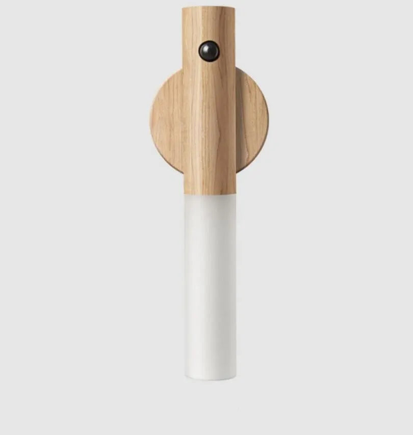 Smart sensor LED desk lamp with solid wood base and clear acrylic shade on a wooden table.