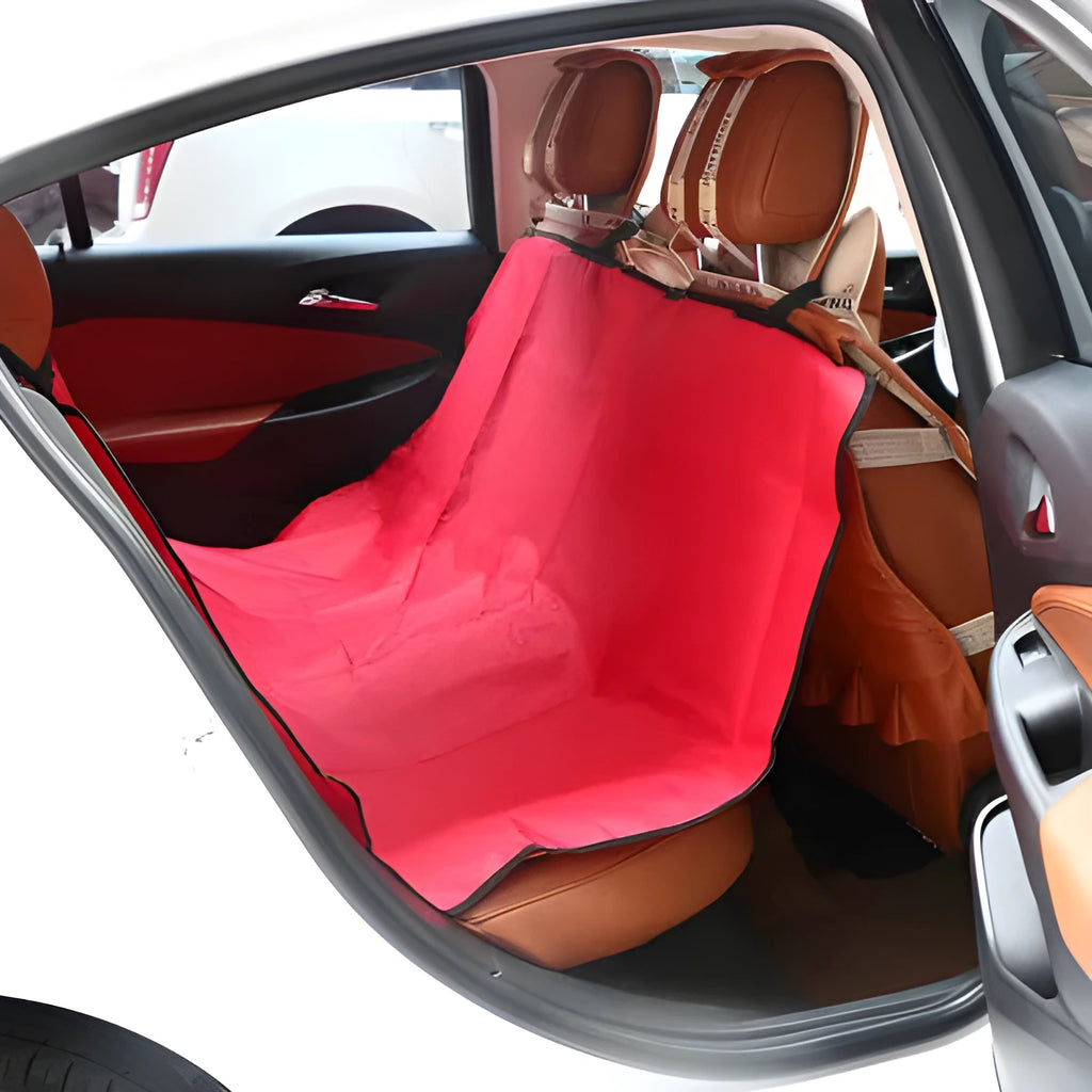 A square, waterproof pet car seat cover pad in blue, laid flat on a car's rear seat.