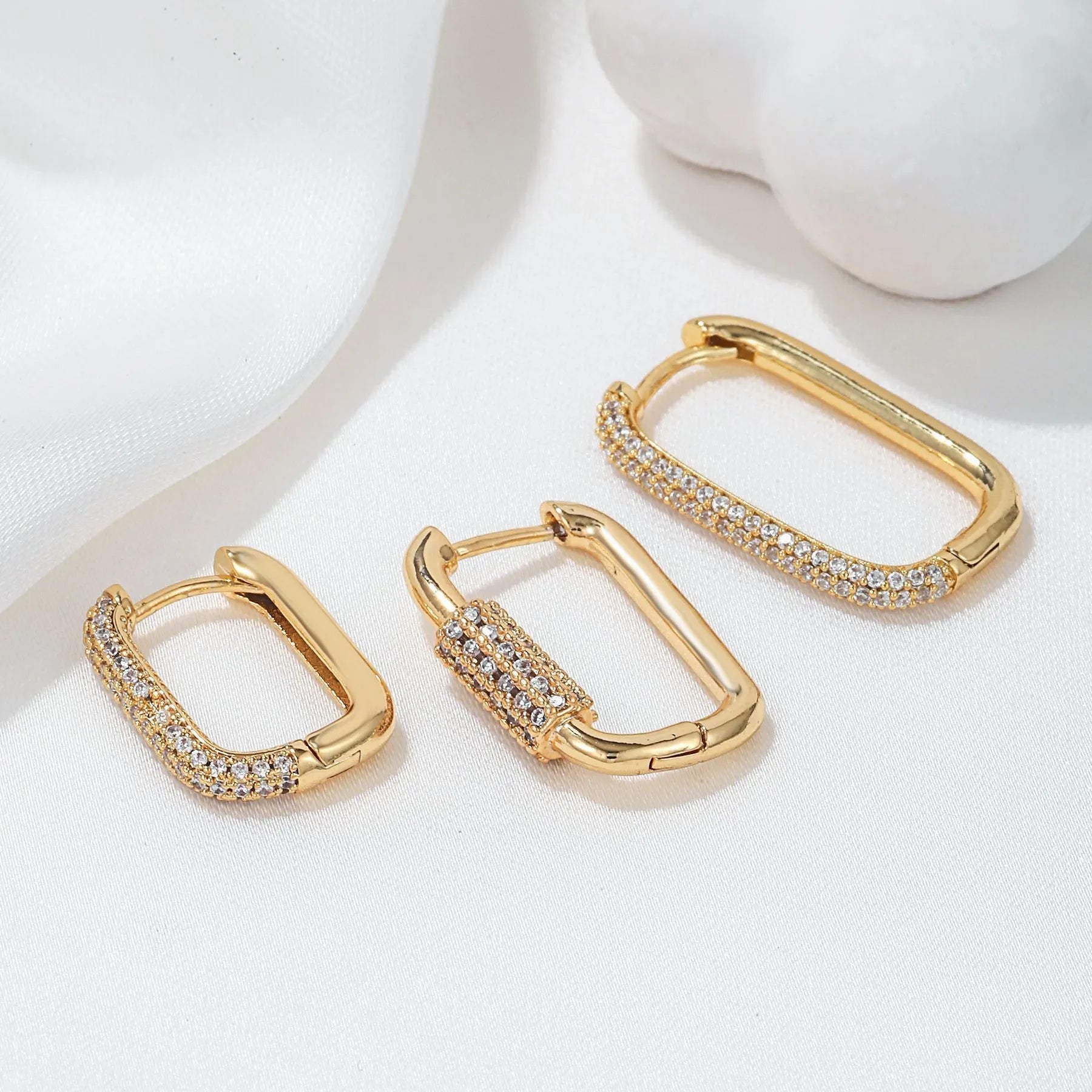 Three geometric zircon ear clips with square design in gold and white colour options