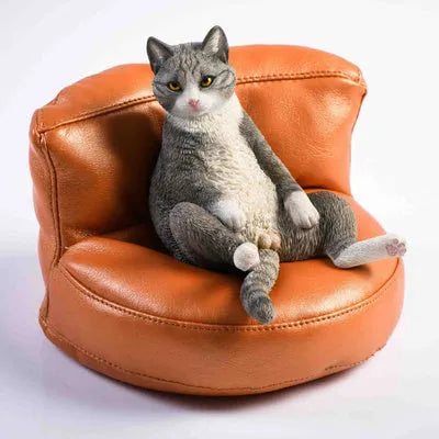 Lazy cat ornament and fabric sofa model set for car dashboard, 7.5cm high.