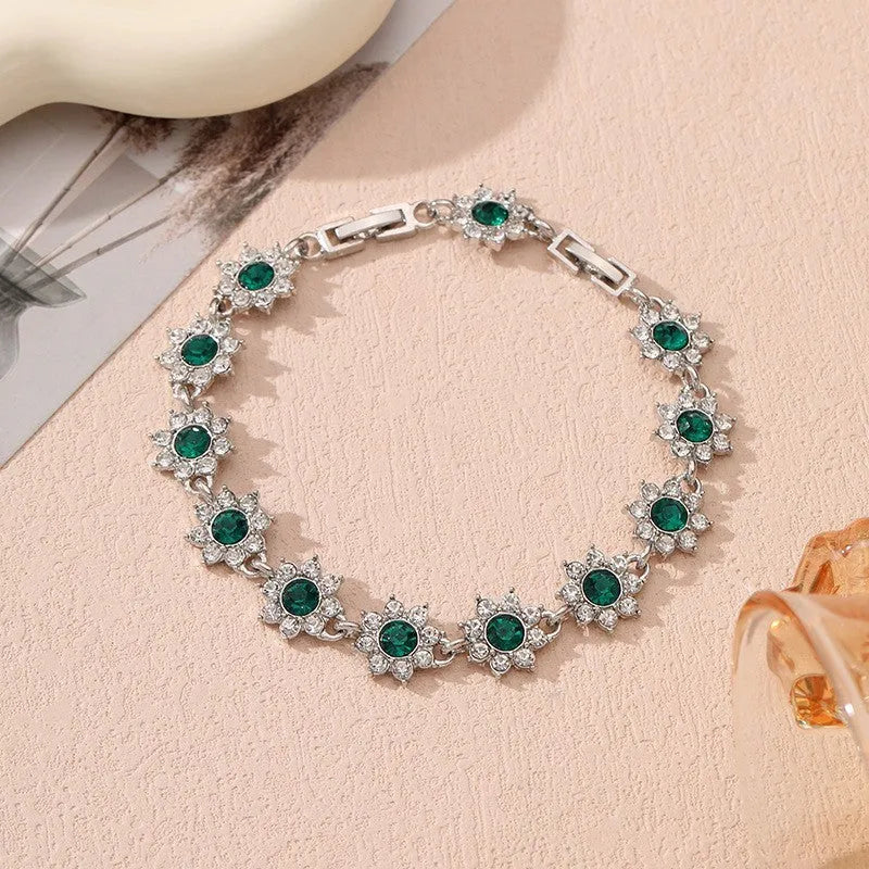 Gold and silver electroplated flower bracelet with coloured gemstone accents on zinc alloy