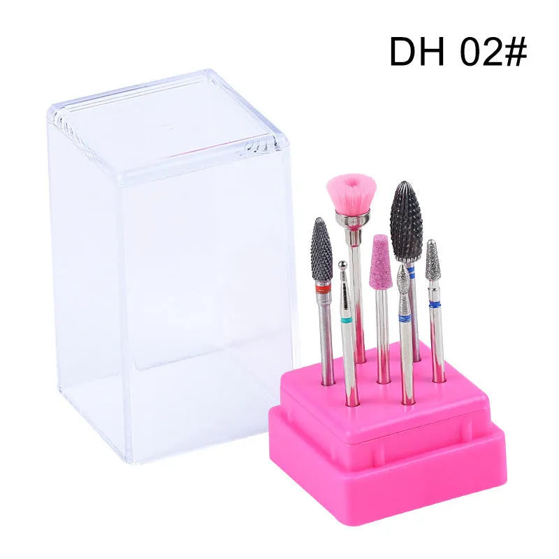 Set of seven tungsten steel nail drill bits and a brush in a clear plastic case.
