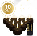 Four black S10 LED tealight candles showing realistic flickering light effect
