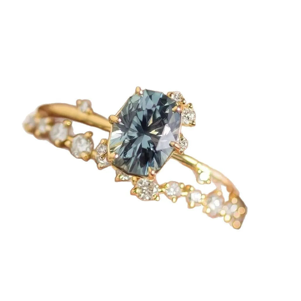 Gold plated flower ring with green zircon stones on display
