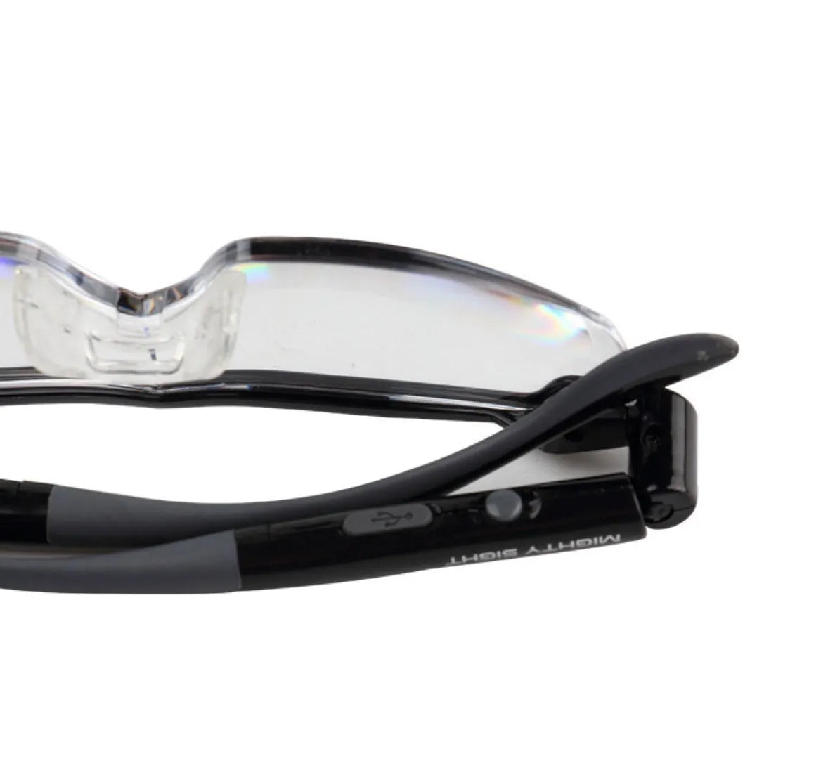 Transparent black USB LED reading light glasses with illuminated frames on a table.