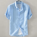 Men's light blue linen blend short sleeve shirt with loose fit on hanger