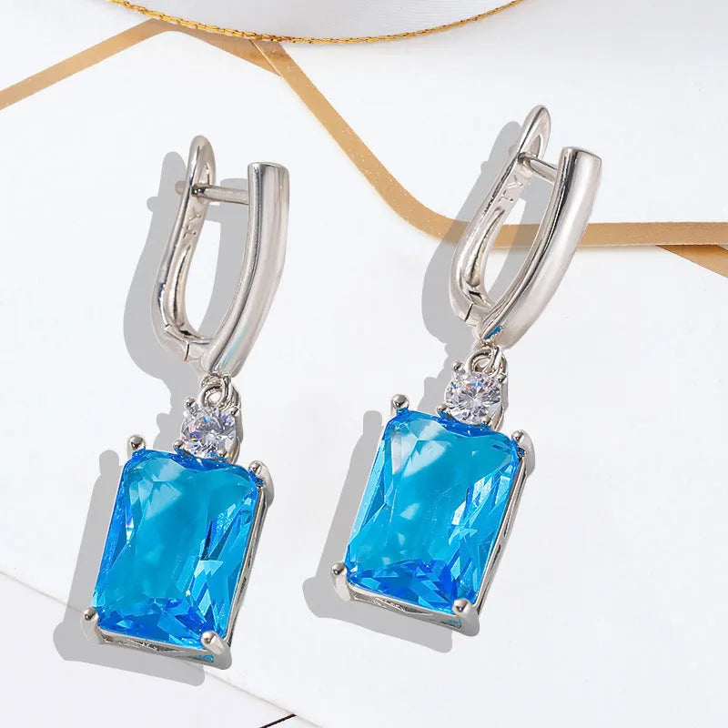 Square geometric copper earrings with electroplated gold finish showing quadrilateral design elements