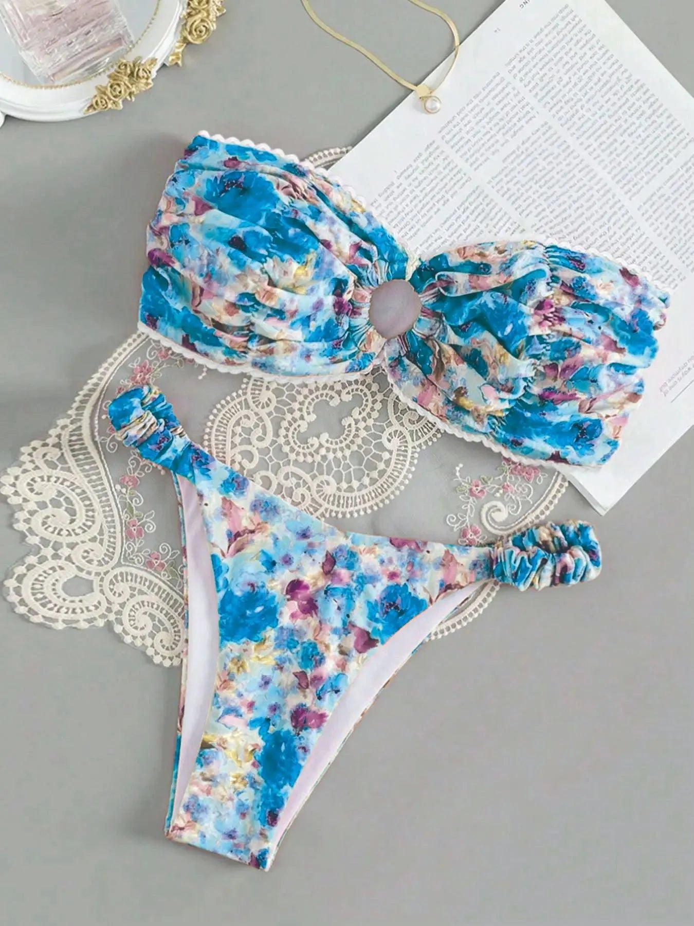 Women's tube top bikini set with lace trim in blue, yellow, pink, and floral print colours.