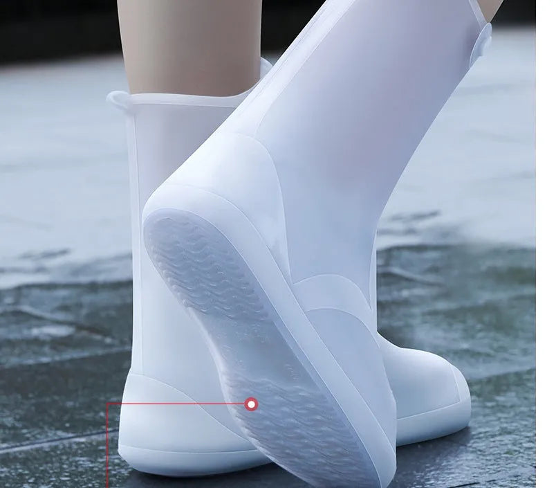 White high top PVC reusable waterproof shoe cover for women, shown on a foot.