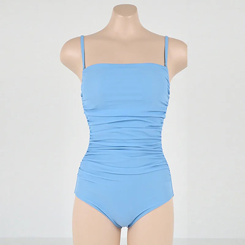 Sling style one-piece swimsuit with belly pleats in blue colour