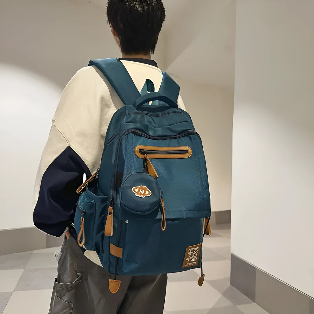 Large black nylon backpack with curved shoulder straps for middle school students